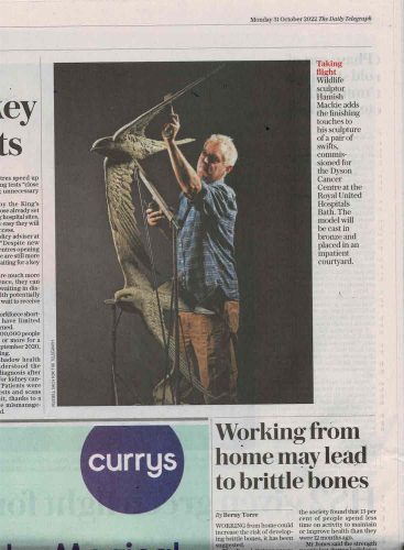 Picture of Hamish with Swift sculpture in Daily Telegraph