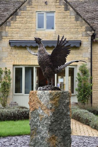 Pheasant sculpture on plinth