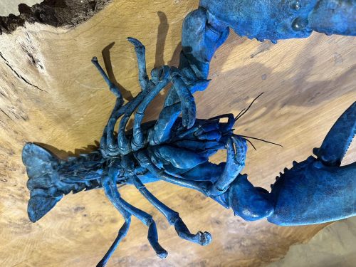 bronze lobster sculpture in blue