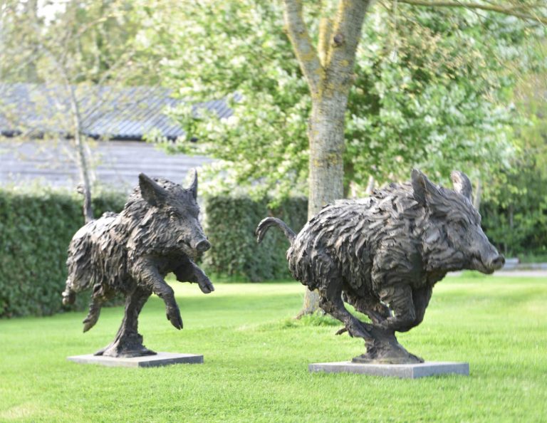 pair of wild boar sculptures