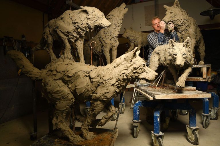 Mackie making sculptures of wolves