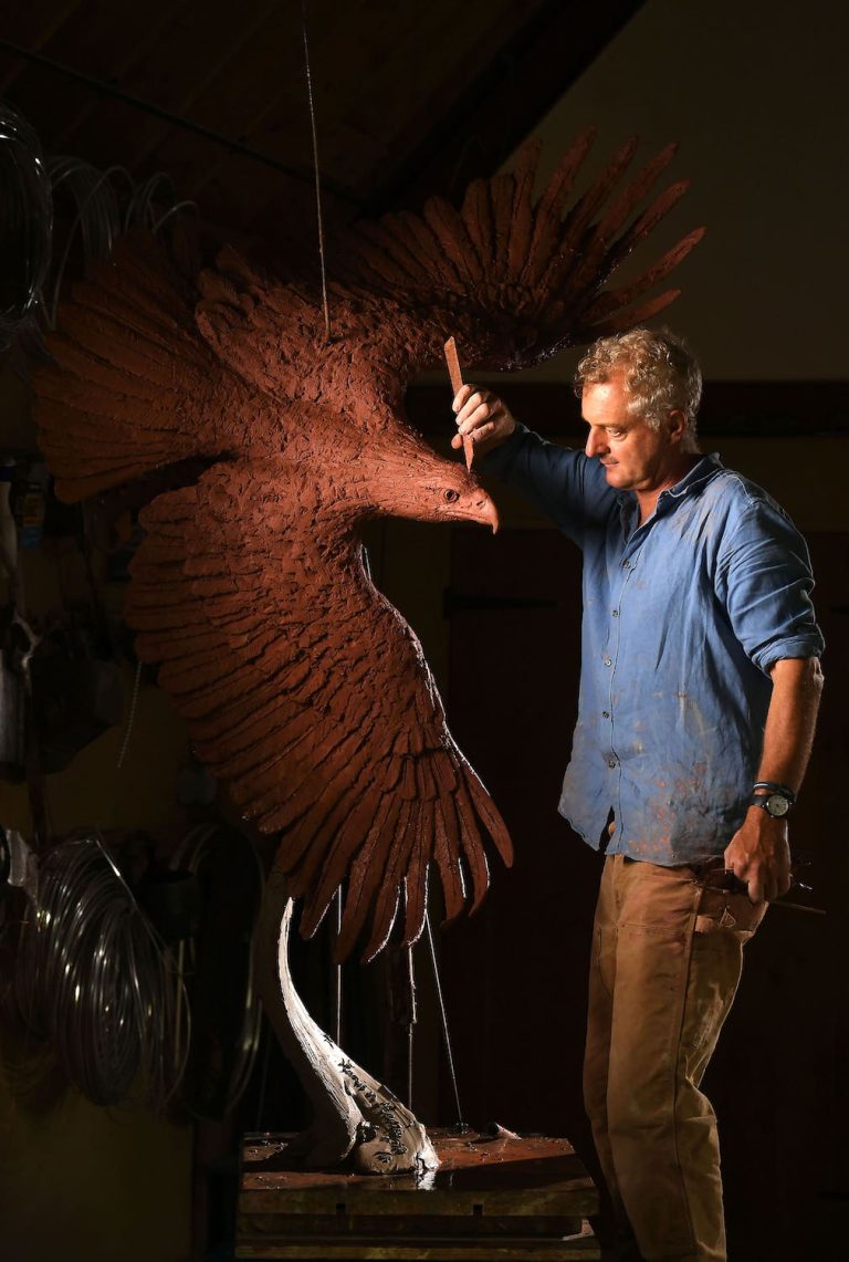 Hamish sculpting bald eagle in studio