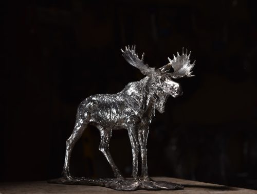 sculpture in silver of moose