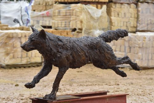 Wolf running sculpture