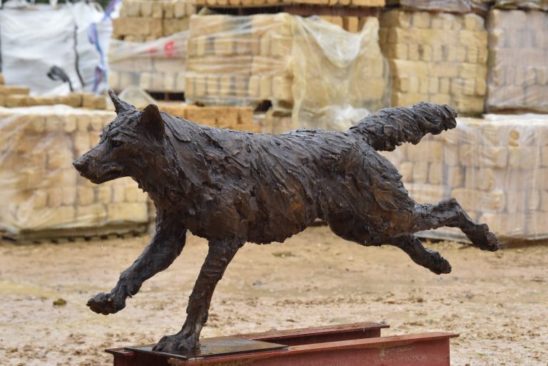 Wolf running sculpture