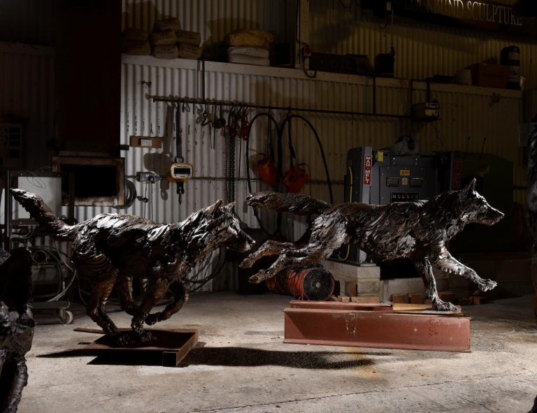 Running wolf bronze sculptures
