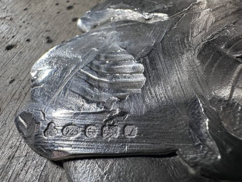 Mackie's signature in silver moose sculpture