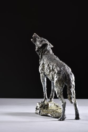 sculpture of male wolf scaled