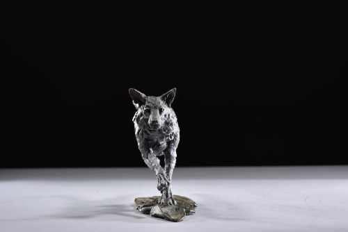 wolf running legs out scaled sculpture
