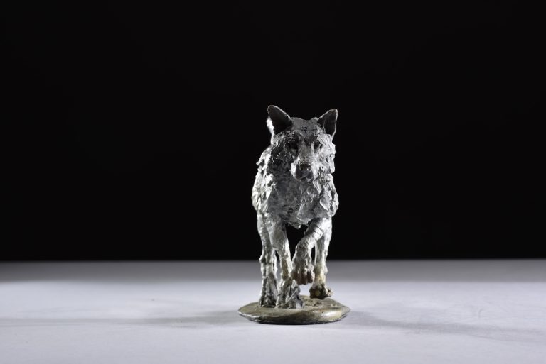 wolf running legs under sculpture