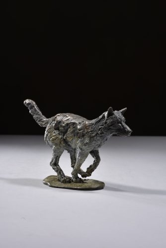 Wolf running scaled sculpture legs under