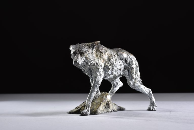 Mackie's wolf on a mound scaled down