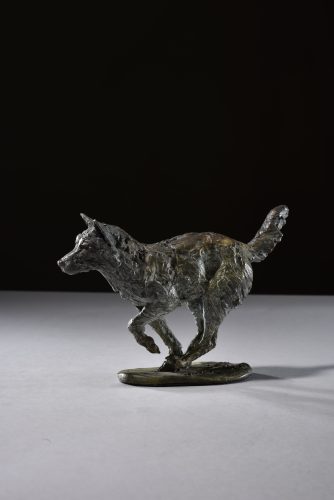 legs under wolf running sculpture