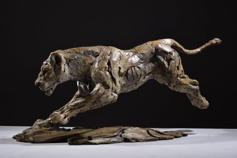 Bronze lioness hunting sculpture