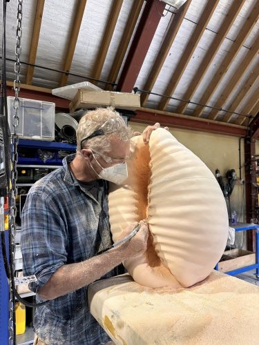 Hamish making cowrie sculpture