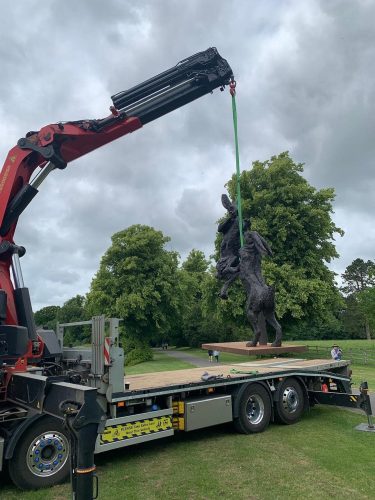 Hares sculpture being craned