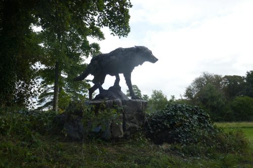 wolf on a mound sculpture
