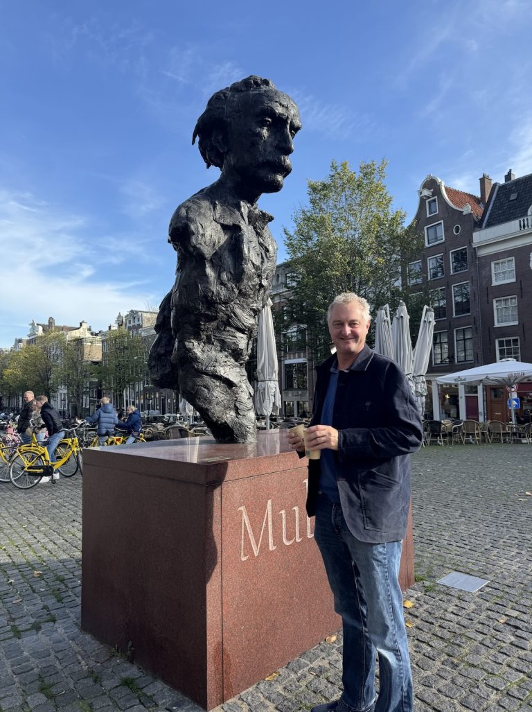 Hamish with Multatuli Sculpture in Amsterdam