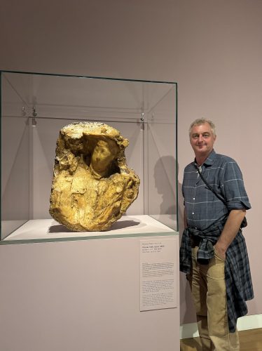 Hamish with a sculpture in museum
