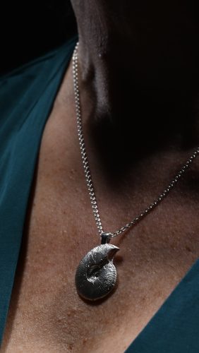 model wearing ammonite pendant