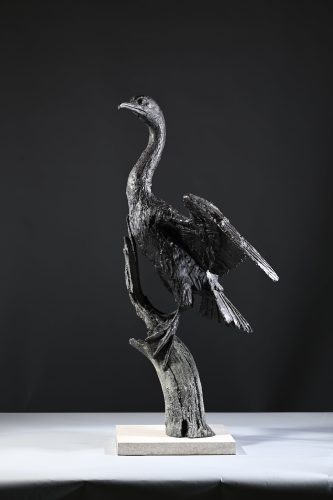 sculpture of cormorant in bronze
