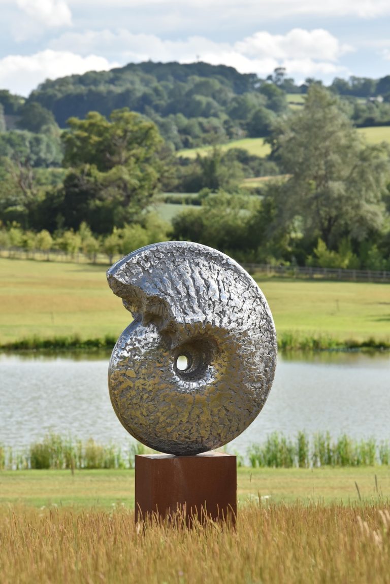 stainless steel ammonite sculpture outdoors