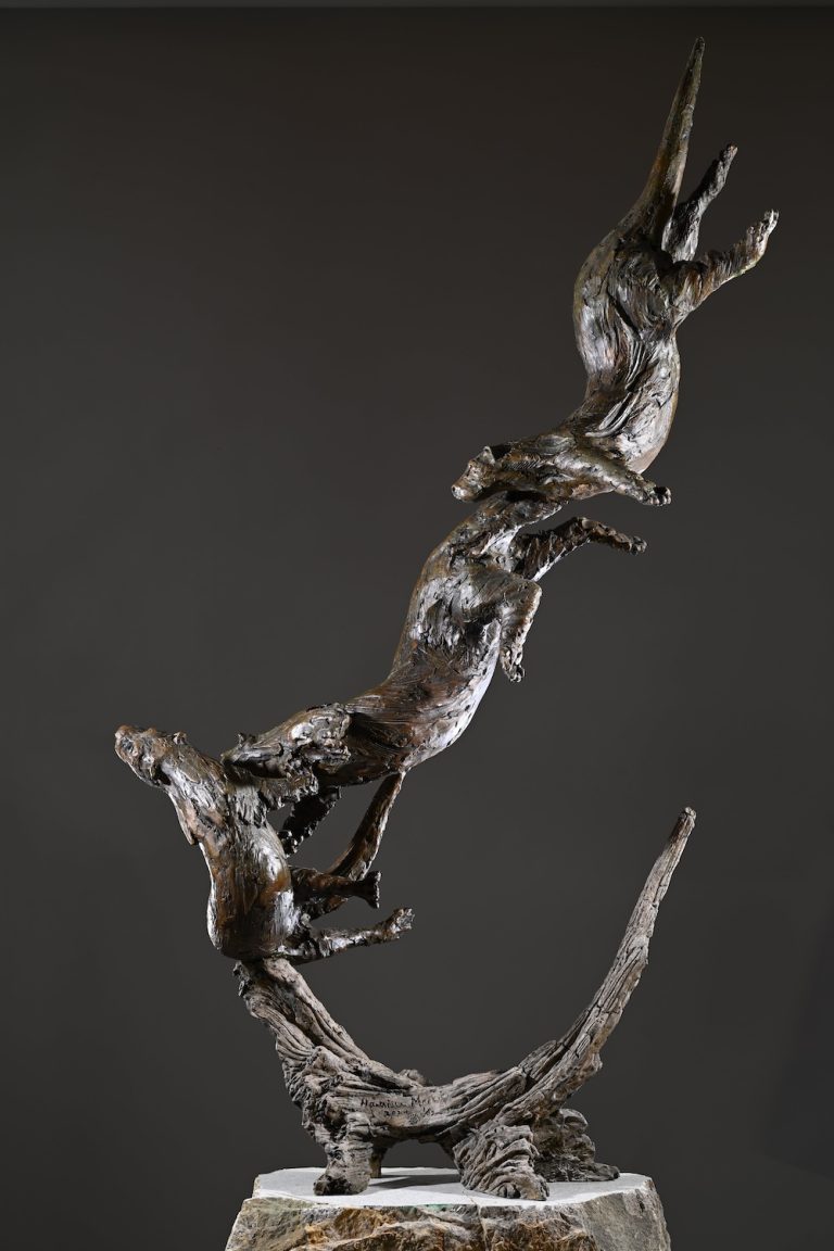 Bronze otter sculpture