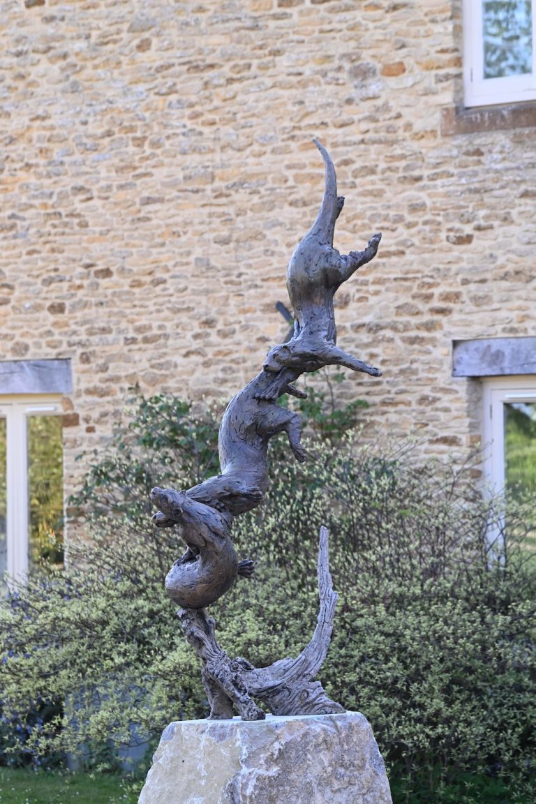Otter sculpture placed outdoors