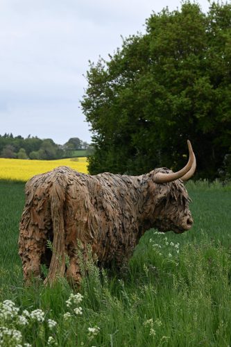 sculpture of life size highland cow