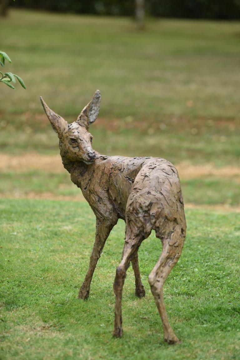 Roe fawn looking back sculpture