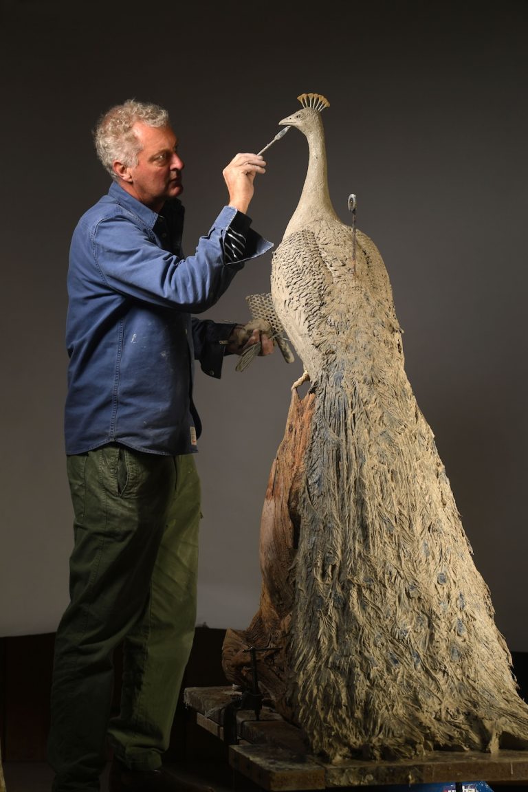Hamish with clay peacock original sculpture