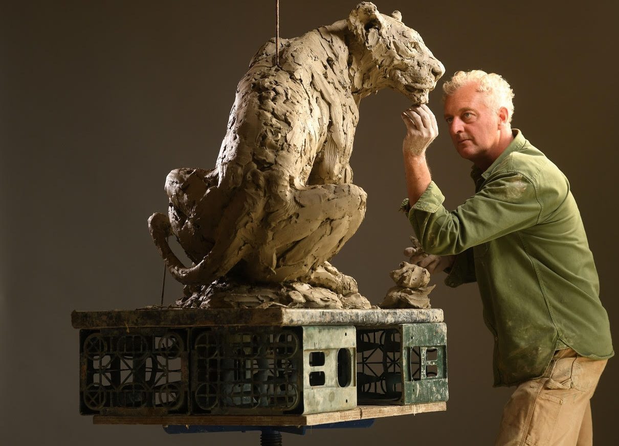 Hamish sculpting leopard sculpture