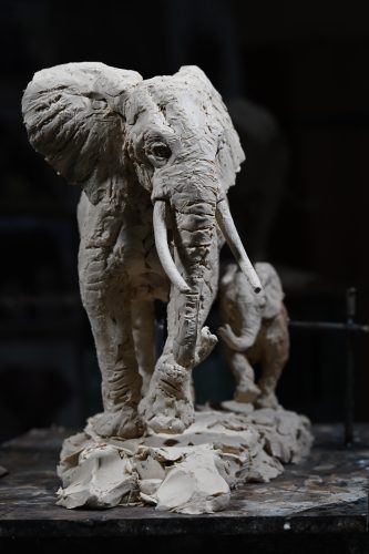 sculpture in clay of elephant mother and calf