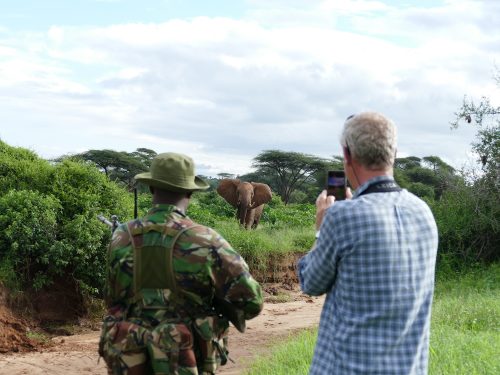 Hamish with ranger watching elephants
