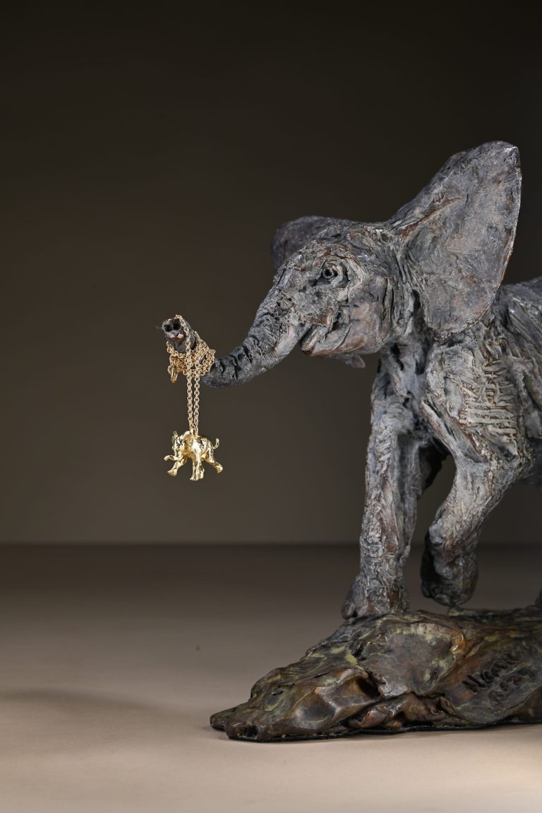 Mackie's gold elephant pendant