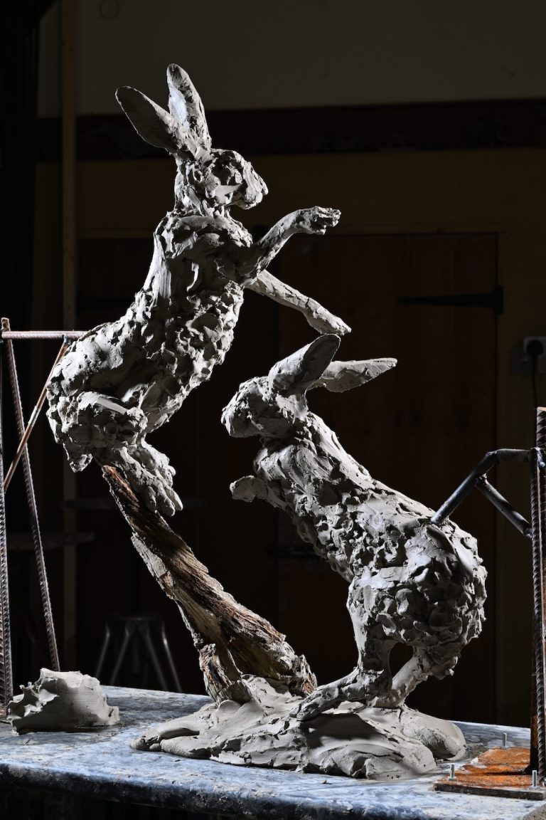 Hamish's Boxing Hares sculpture in clay