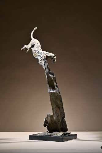sculpture of leopard jumping