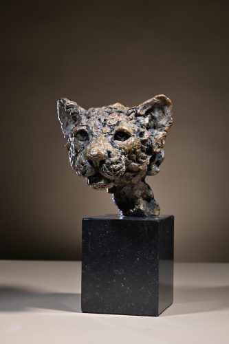 Bronze leopard cub head