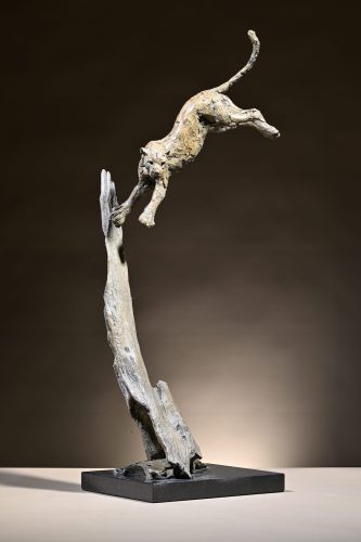 bronze leopard jumping out of tree sculpture