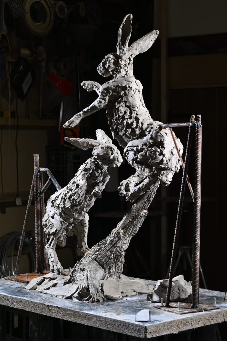 Boxing hares in clay