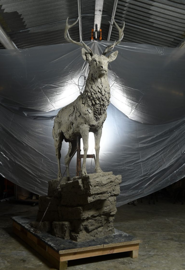 clay sculpture of red stag