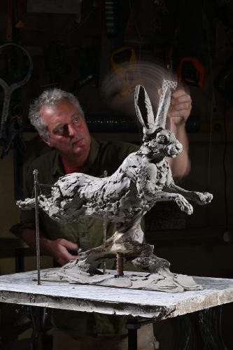 Sculpting hare airborne